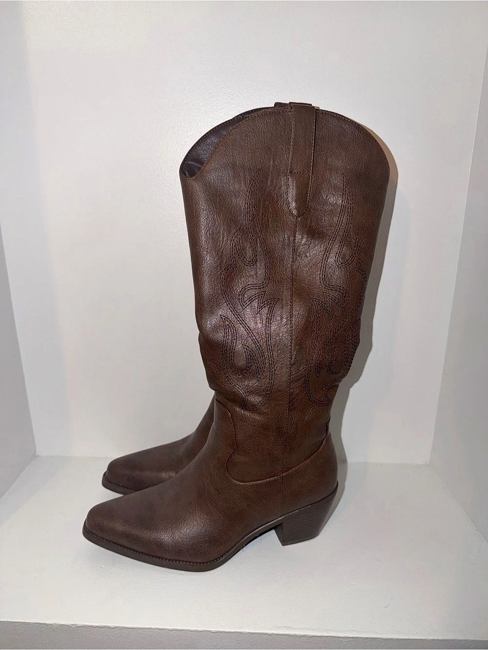 Brown knee high cowboy boots